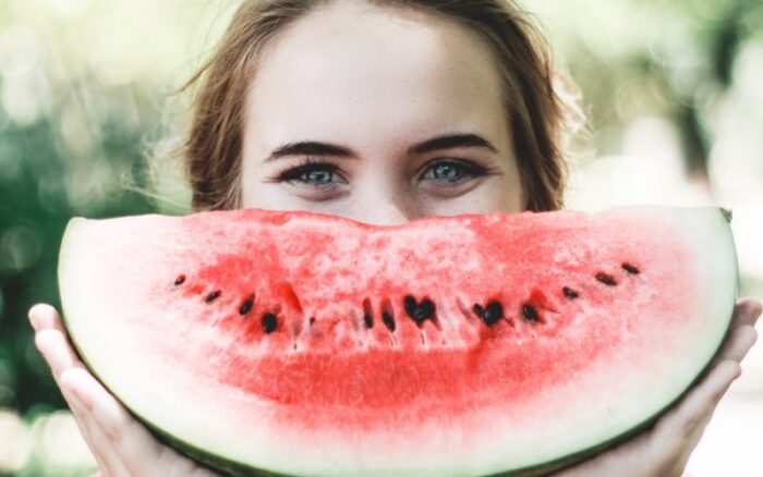 Woman smiling with watermelon