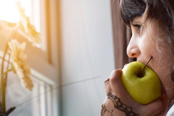 Child eating an apple