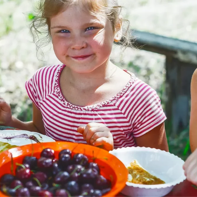 child-eating- fruit Child eating fruit