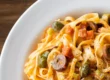 Eating a bowl of pasta