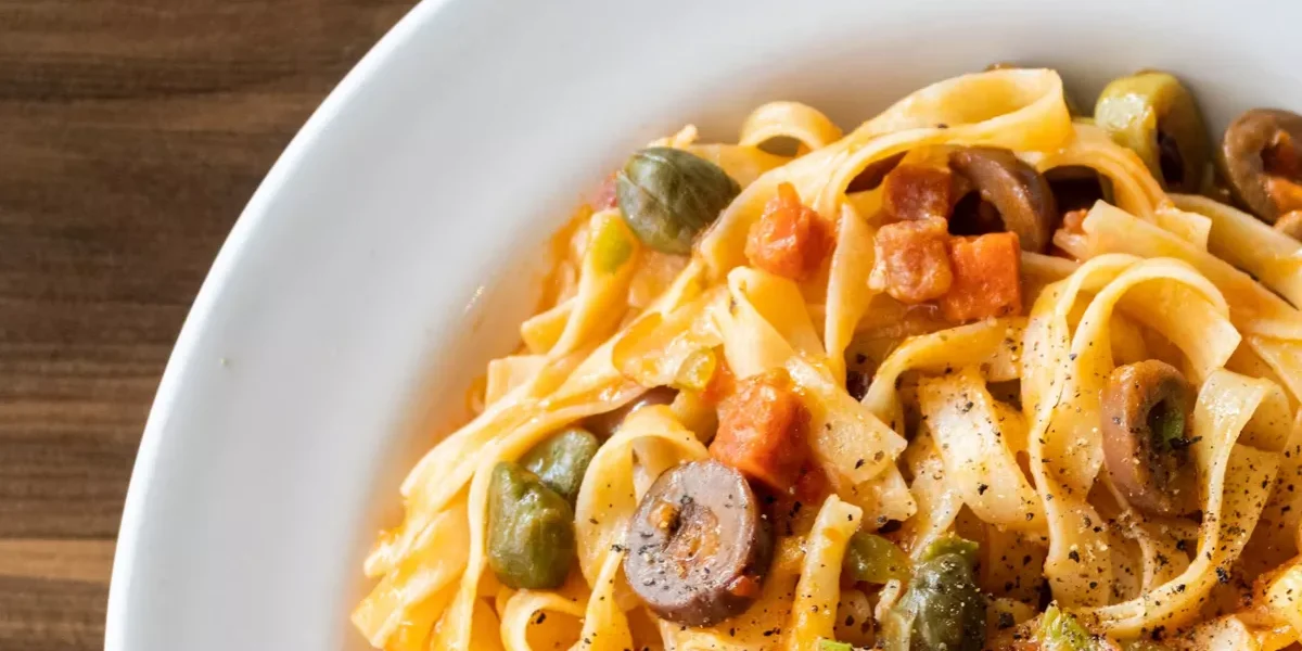 Eating a bowl of pasta