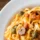Eating a bowl of pasta
