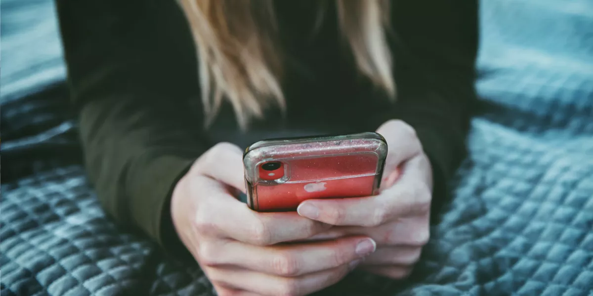 Teenager on phone researching diets